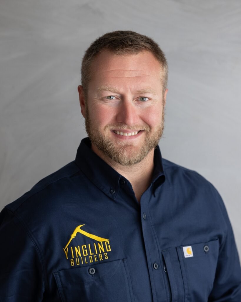 Portrait of a smiling man in a Yingling Builders work shirt